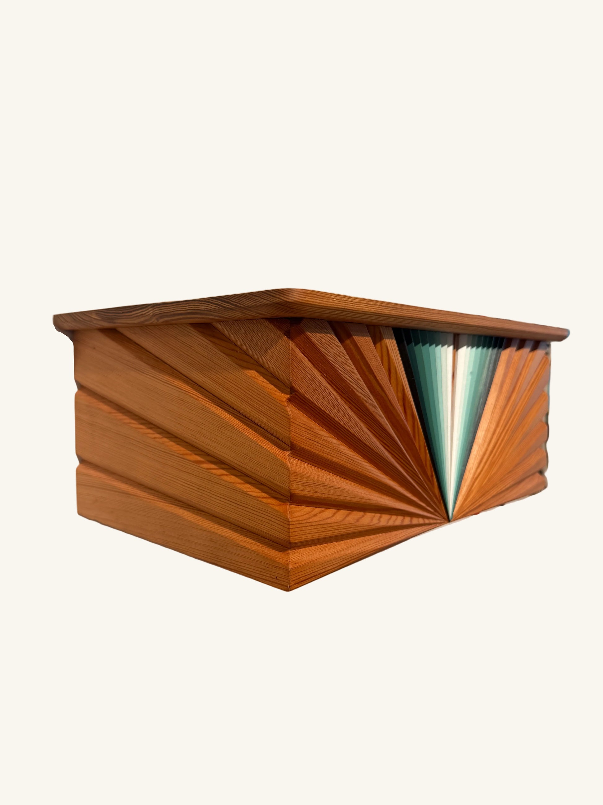 Wooden box with geometric design on a light surface
